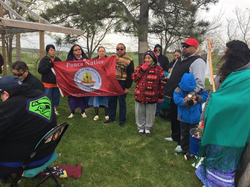 Ponca Nation community gathering with flag